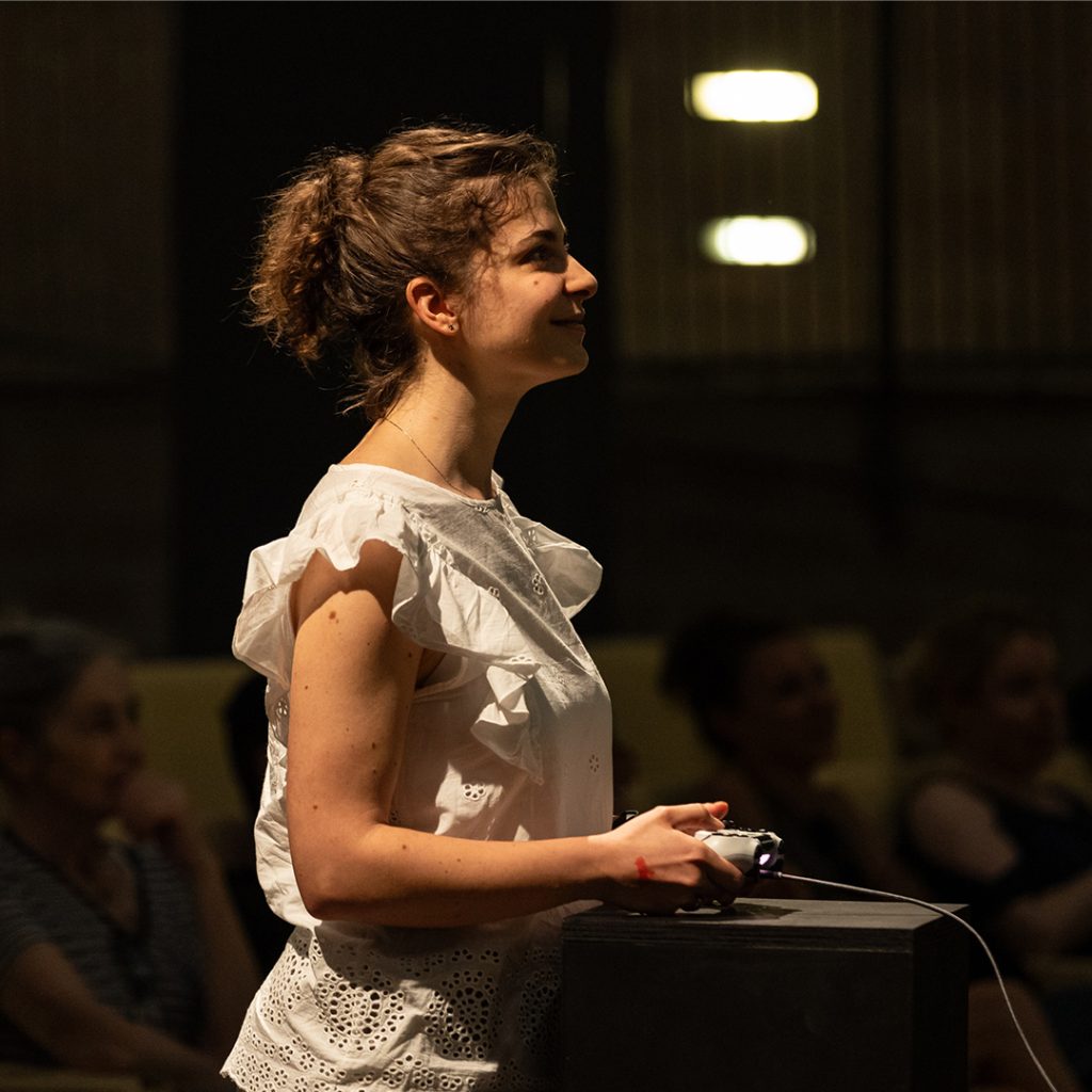 Audience member holds a console.